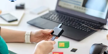 A person using sd card reader and sim cards on the table - Can An Sd Card Reader Read A Sim Card